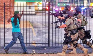 Militarized Police in Ferguson, MO confront an unarmed citizen