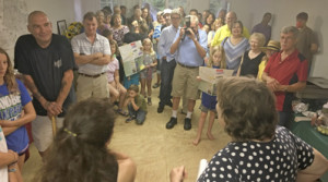 Friends and neighbors gather to honor Anne (right, foreground)