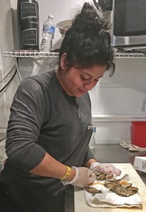Jessy Diaz preparing some oysters at the King Street Oyster Bar 