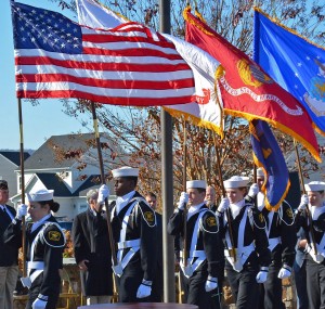 An honor guard, showing the colors of the armed services