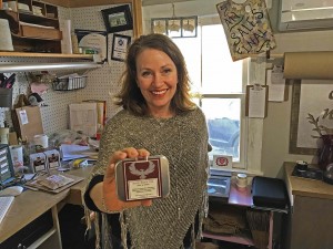 Denise Berg, the owner of Lovettsville’s ‘Painted Pig,’ with the tea that helps vets